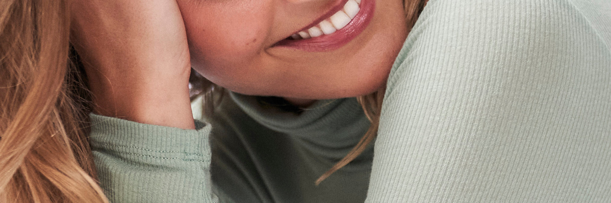 Close up of a khaki ribbed knit dress