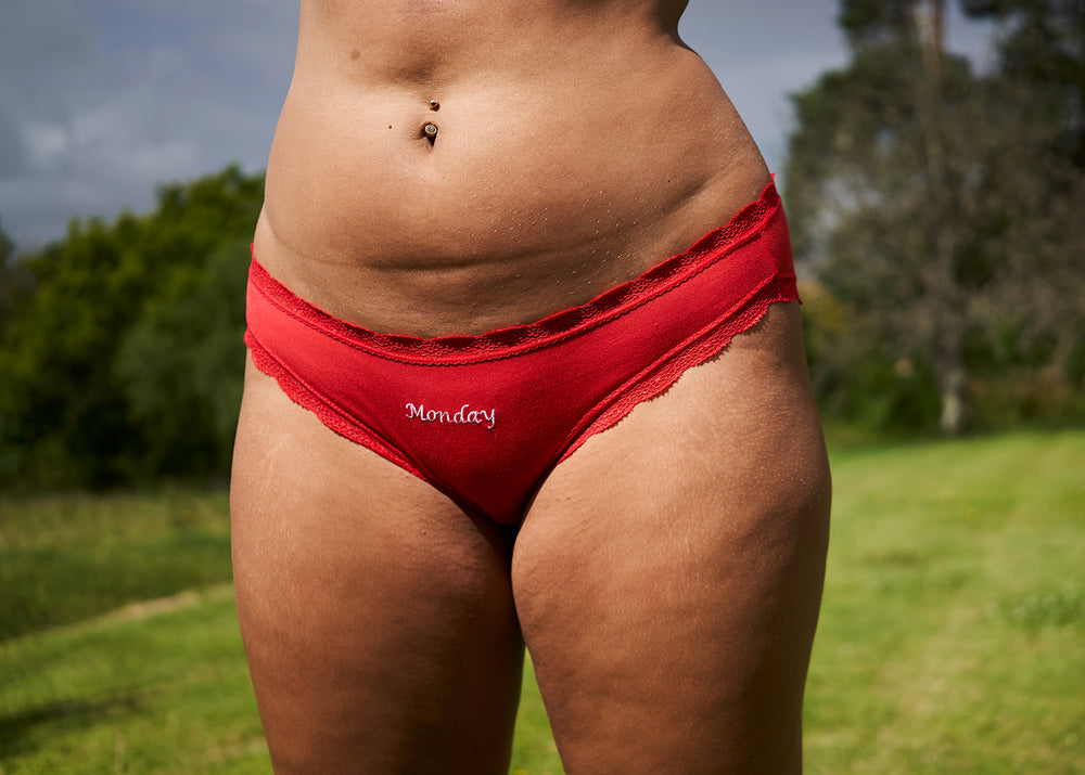 Woman wearing red 'Friday' knickers
